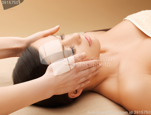 Image of beautiful woman in massage salon