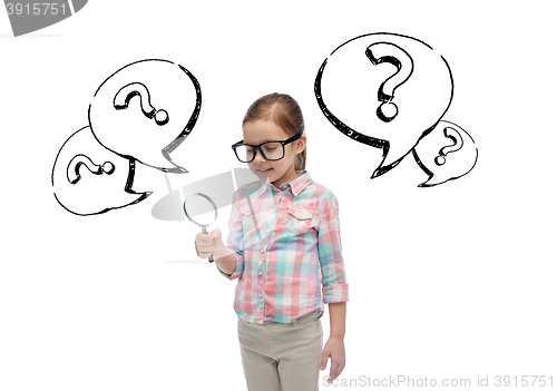 Image of little girl in eyeglasses with magnifying glass