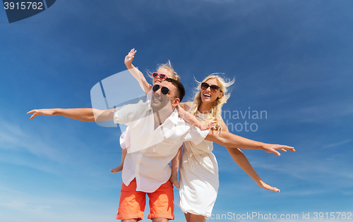 Image of happy family having fun over blue sky background