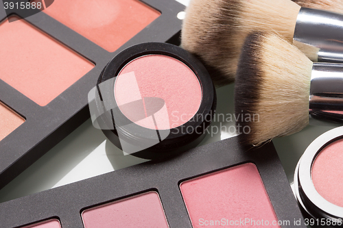 Image of make-up cosmetics. compact powder, mineral foundation and makeup brushes