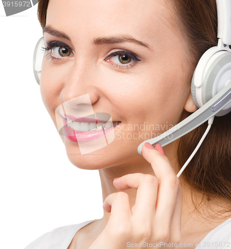 Image of Lovely young woman is talking to customers