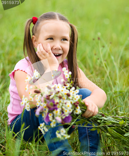 Image of Portrait of a little girl with flowers