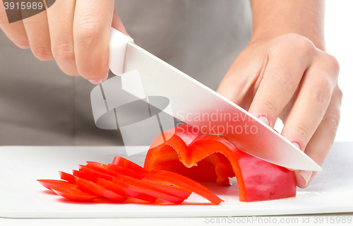 Image of Cook is chopping bell pepper