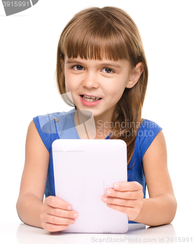 Image of Young girl is using tablet