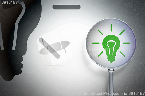Image of Finance concept:  Light Bulb with optical glass on digital background