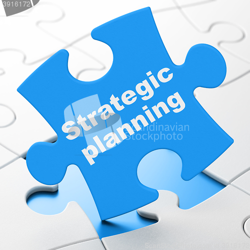 Image of Finance concept: Strategic Planning on puzzle background