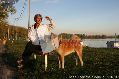 Image of Lady sitting on the bench