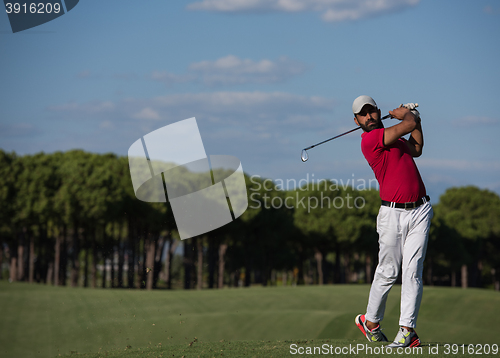 Image of golf player hitting long shot