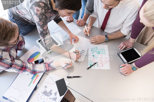 Image of young business people group on meeting at modern office