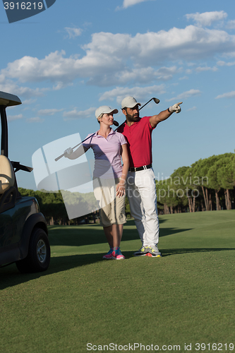 Image of portrait of golfers couple on golf course