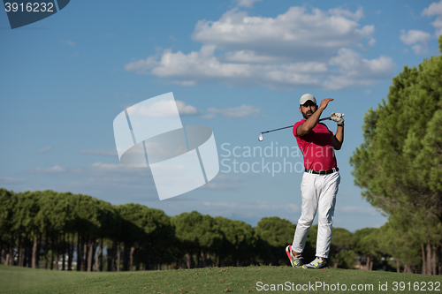 Image of golf player hitting long shot