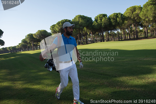 Image of golf player walking