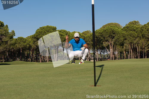 Image of golf player aiming perfect  shot