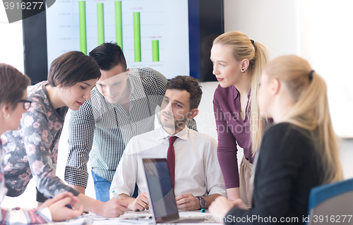 Image of young business people group on meeting at modern office