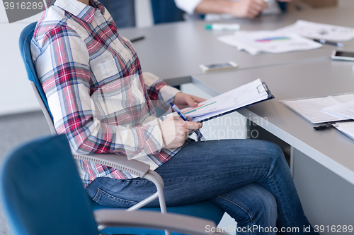Image of portrait of young business woman at office with team on meeting 