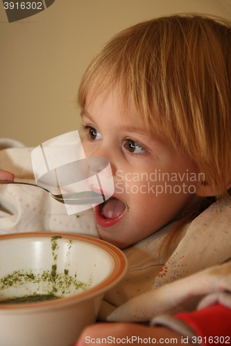 Image of Young girl eating