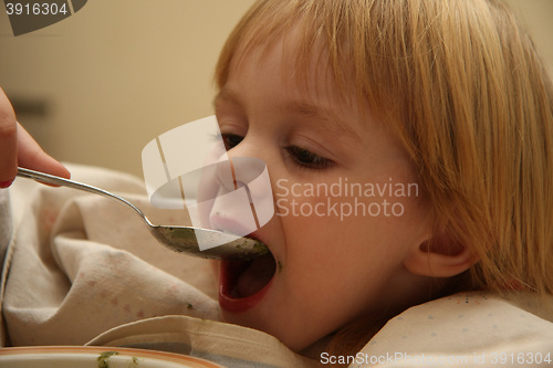 Image of Young girl eating