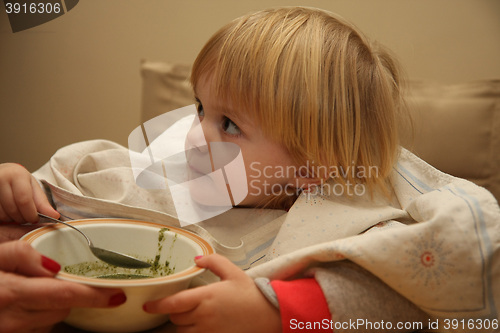 Image of Young girl eating