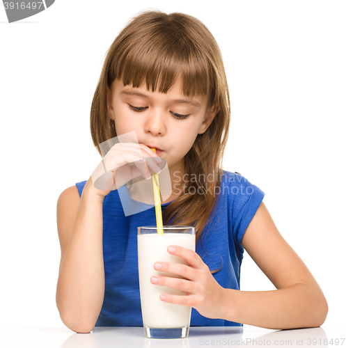 Image of Cute little girl with a glass of milk