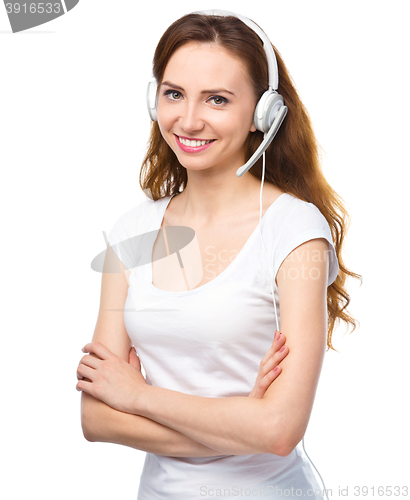 Image of Lovely young woman is talking to customers