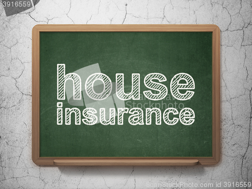 Image of Insurance concept: House Insurance on chalkboard background