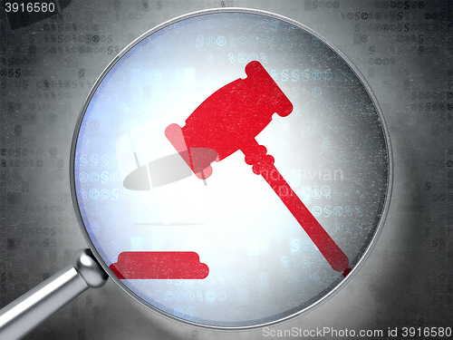 Image of Law concept: Gavel with optical glass on digital background