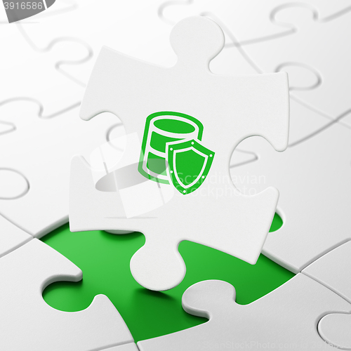 Image of Software concept: Database With Shield on puzzle background