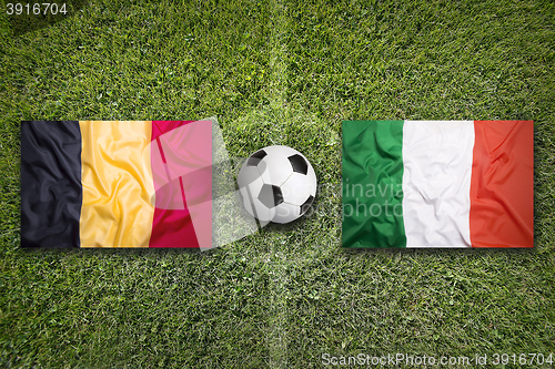 Image of Belgium vs. Italy flags on soccer field