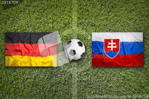 Image of Germany vs. Slovakia flags on soccer field