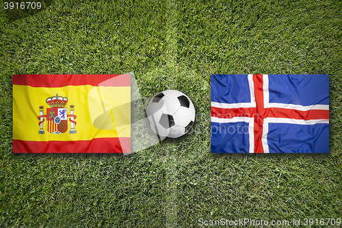 Image of Spain vs. Iceland flags on soccer field