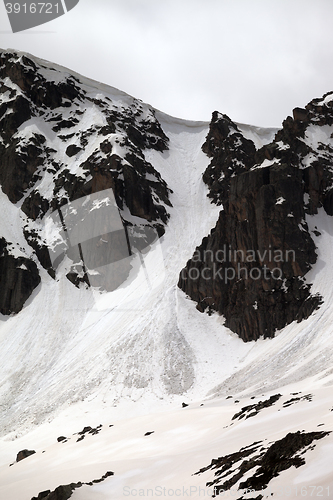 Image of Rocks with snow cornices and traces from avalanches