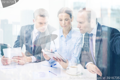 Image of business team with tablet pc having discussion