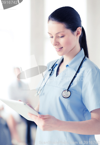 Image of female doctor with tablet pc