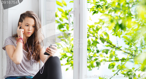 Image of teenage girl with smartphone and earphones