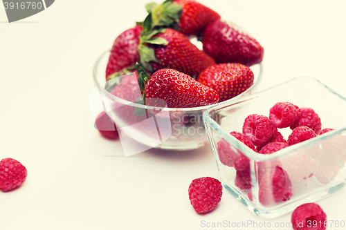 Image of close up of ripe red strawberries and raspberries