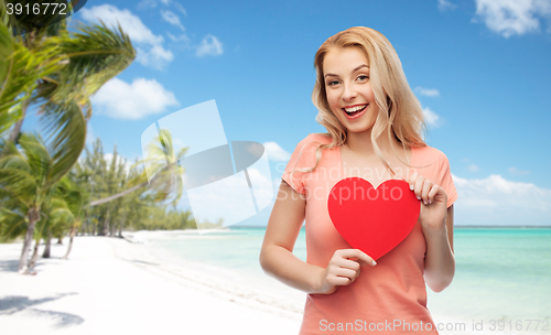 Image of happy woman or teen girl with red heart shape