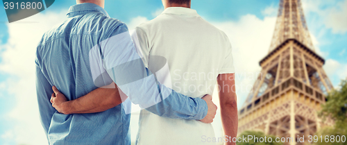 Image of close up of male gay couple over eiffel tower