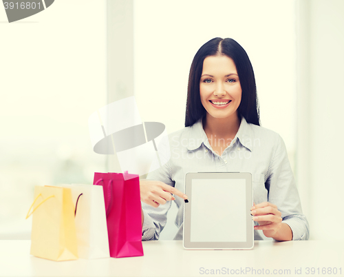 Image of smiling woman with blank screen tablet pc
