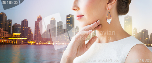 Image of close up of beautiful woman face with earrings