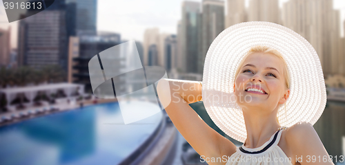 Image of happy woman enjoying summer over dubai city