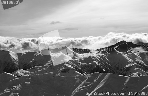 Image of Black and white evening snowy mountains
