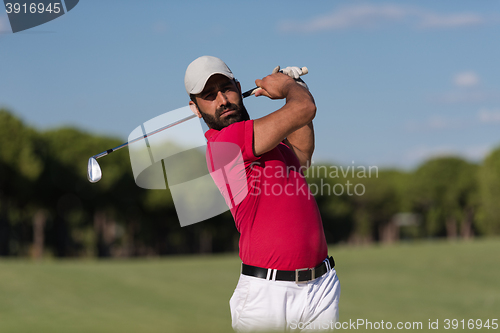 Image of golfer hitting a sand bunker shot