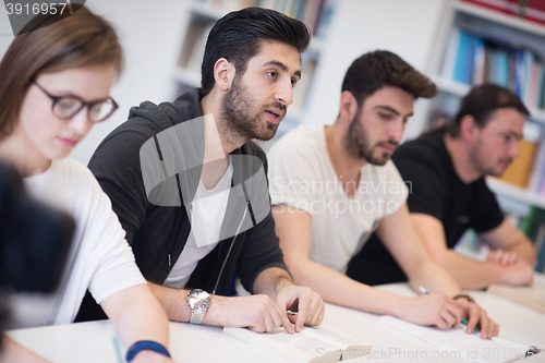 Image of group of students study together in classroom