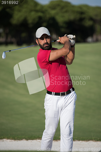 Image of golfer hitting a sand bunker shot