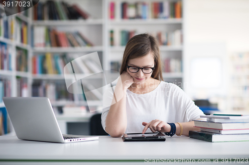 Image of female student study in school library