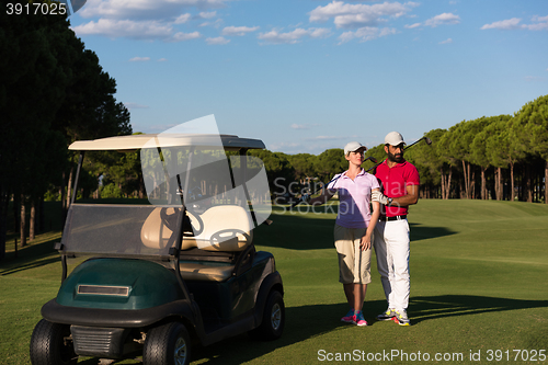 Image of couple in buggy on golf course