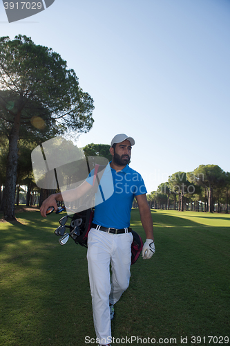 Image of golf player walking