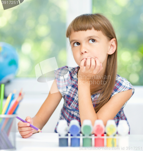 Image of Little girl is daydreaming