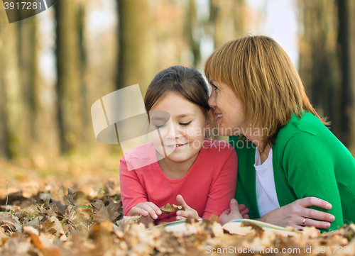 Image of Mother is talking to her daughter