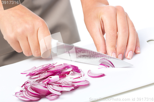 Image of Cook is chopping onion